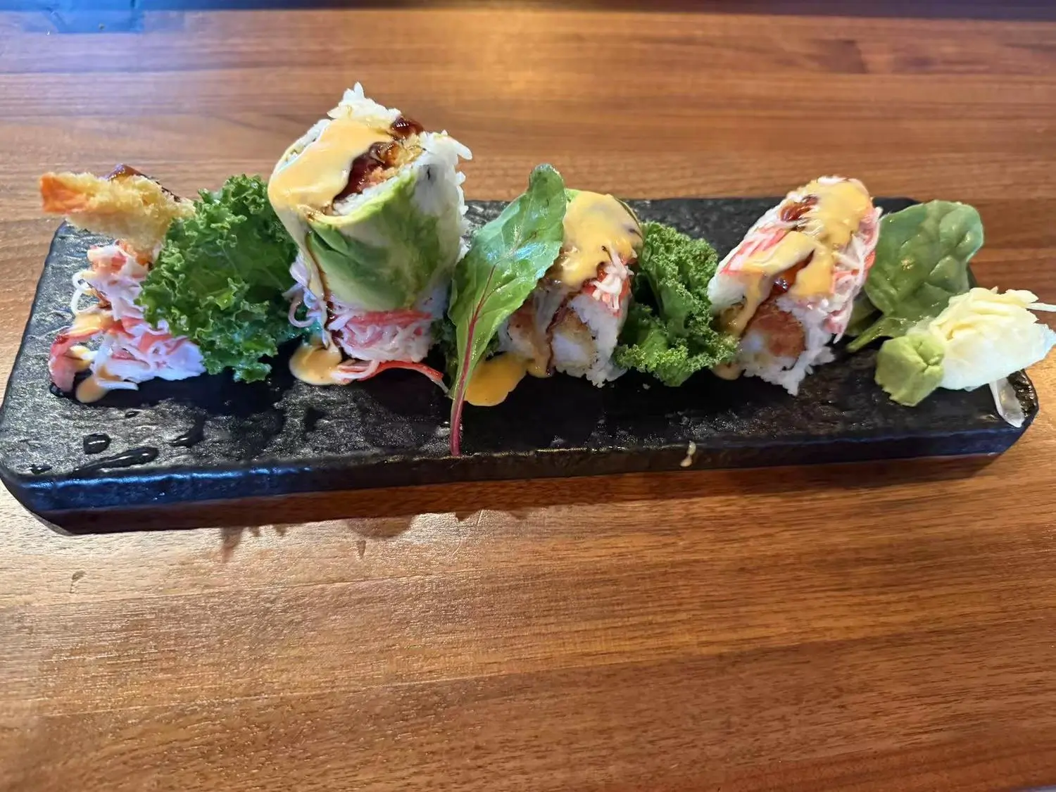 Special Sushi Roll - Assorted sushi rolls with sauces and garnishes at Koi Ramen&Sushi, a Japanese restaurant in Hutchinson