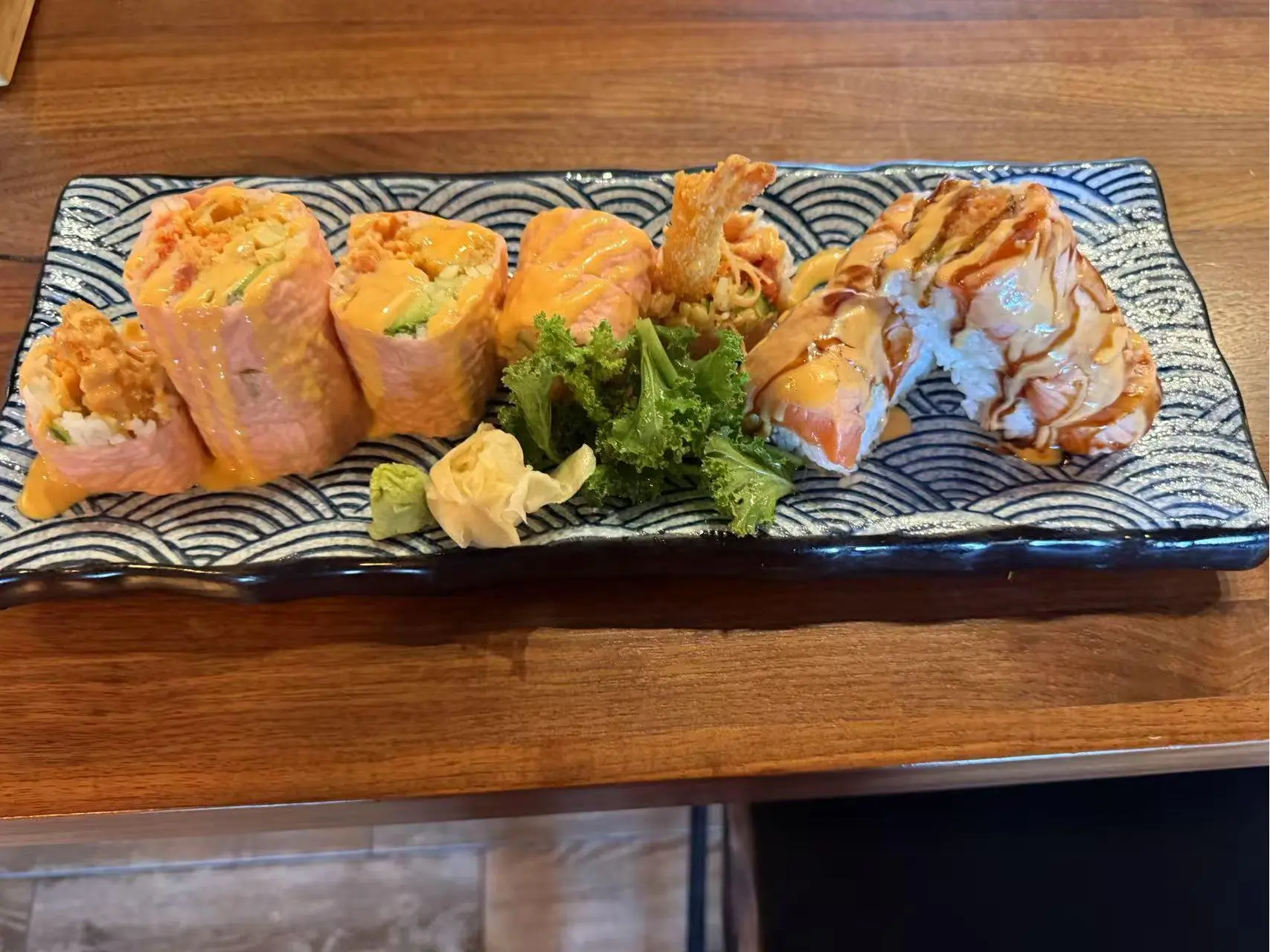 Mixed Sushi Platter - Variety of sushi rolls with sauces and greens at Koi Ramen&Sushi, a Japanese restaurant in Hutchinson
