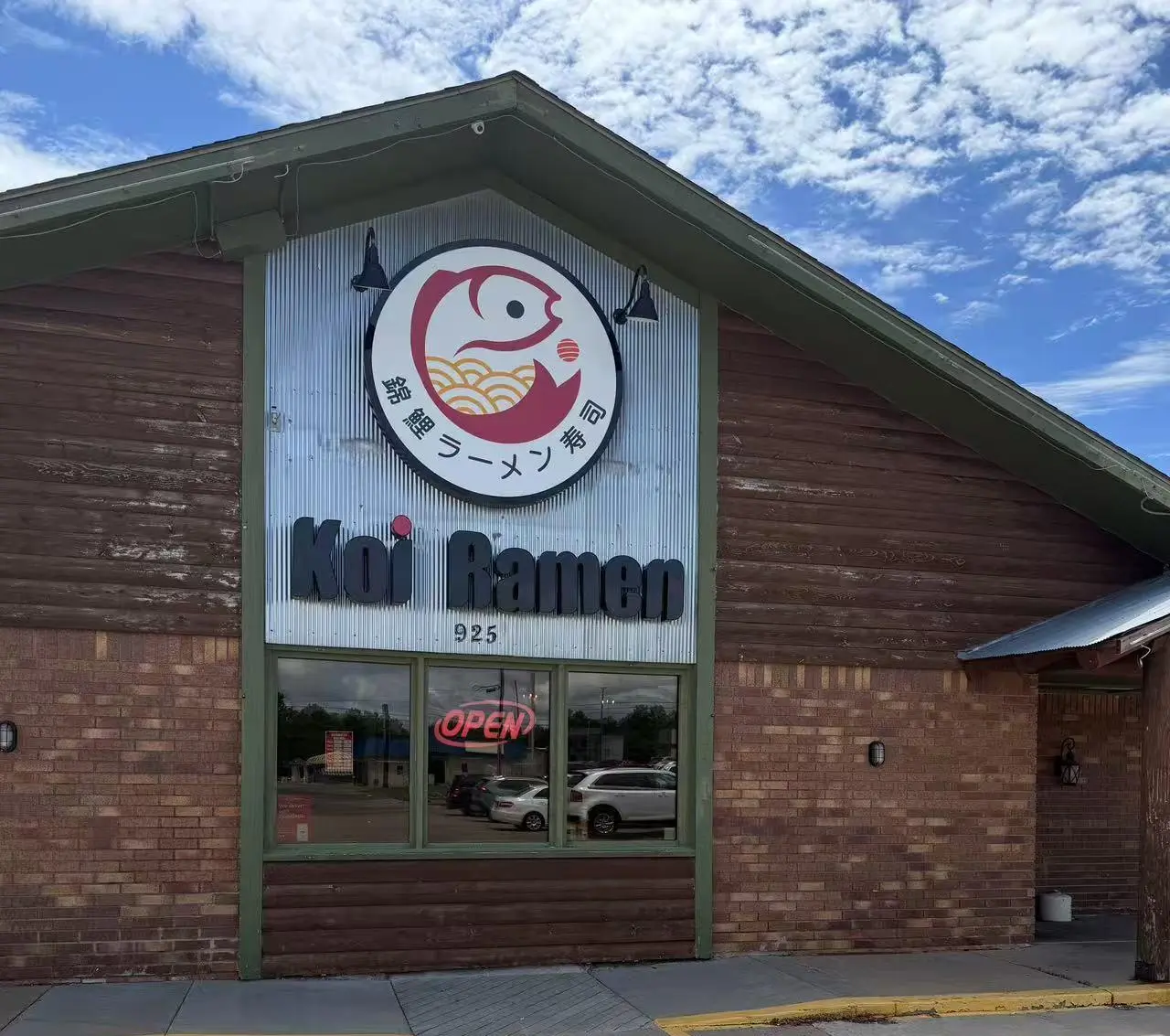 Restaurant Exterior - The outside of the restaurant with a sign displaying "Koi Ramen" and an open sign at Koi Ramen&Sushi, a Japanese restaurant in Hutchinson