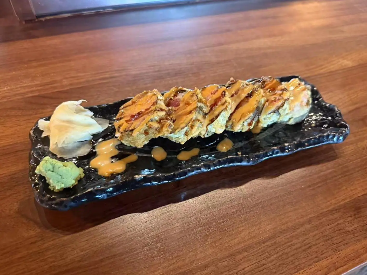 Fried Sushi Roll - Deep - fried sushi rolls with sauce at Koi Ramen&Sushi, a Japanese restaurant in Hutchinson